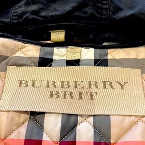 3/4 length hooded raincoat with detachable quilted vest by Burberry